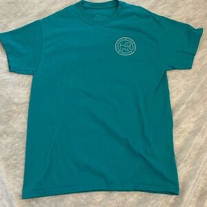 Puppie Live teal fall-themed tee